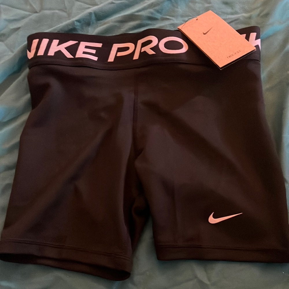 Brand, new Nike pros never worn size girls large very good quality.